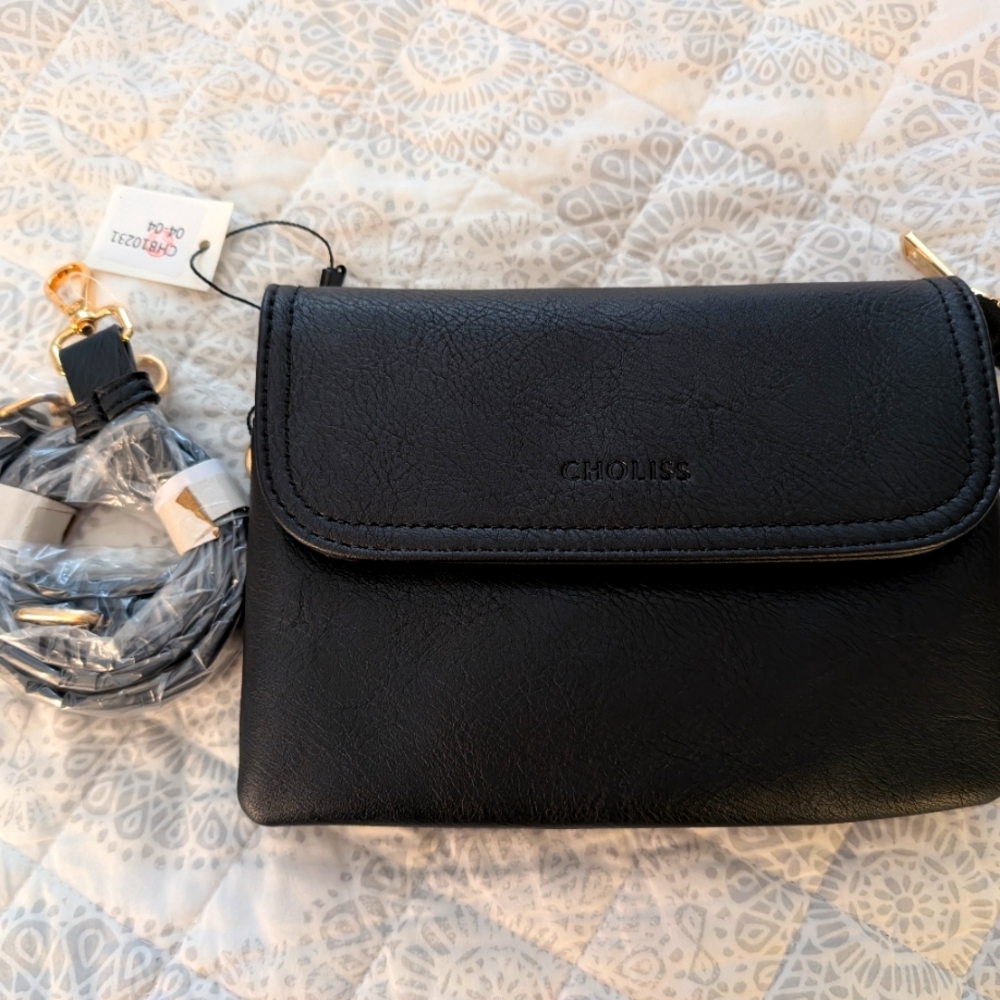 Black Crossbody Bag with Flap Closure and Decorative Charm